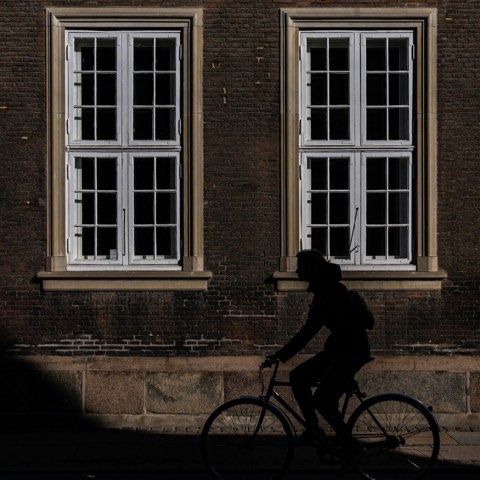 Cyclist in silhouette, Copenhagen, the København window